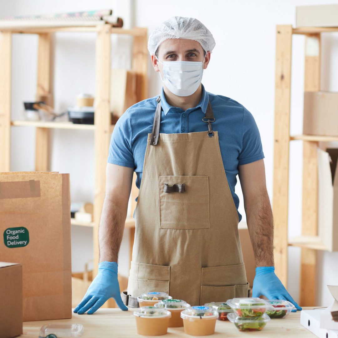 worker-wearing-mask-at-food-delivery-service-2023-11-27-05-27-25-utc worker-wearing-mask-at-food-delivery-service-2023-11-27-05-27-25-utc